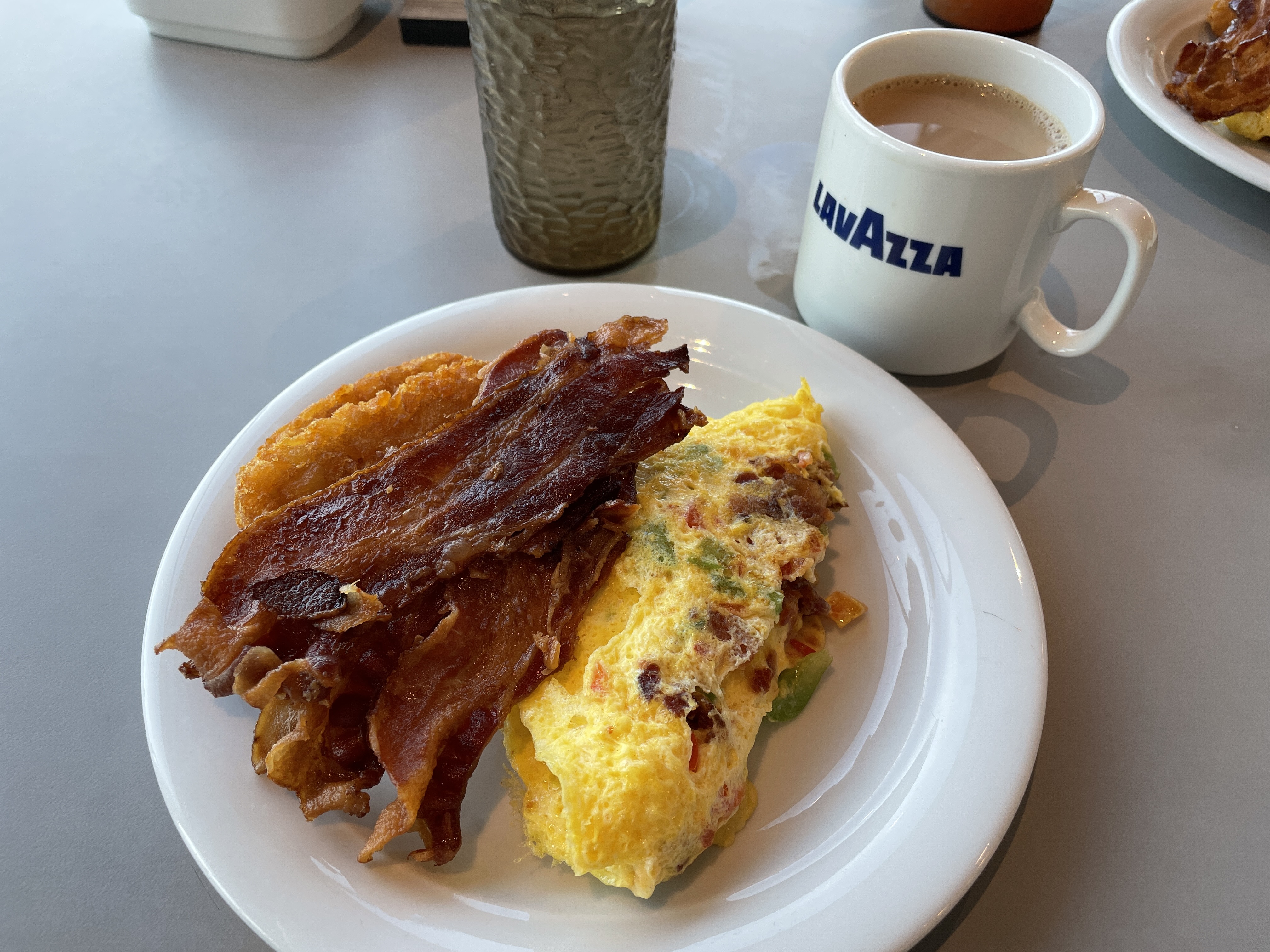 Breakfast on Celebrity Cruise Ship with omelet and bacon
